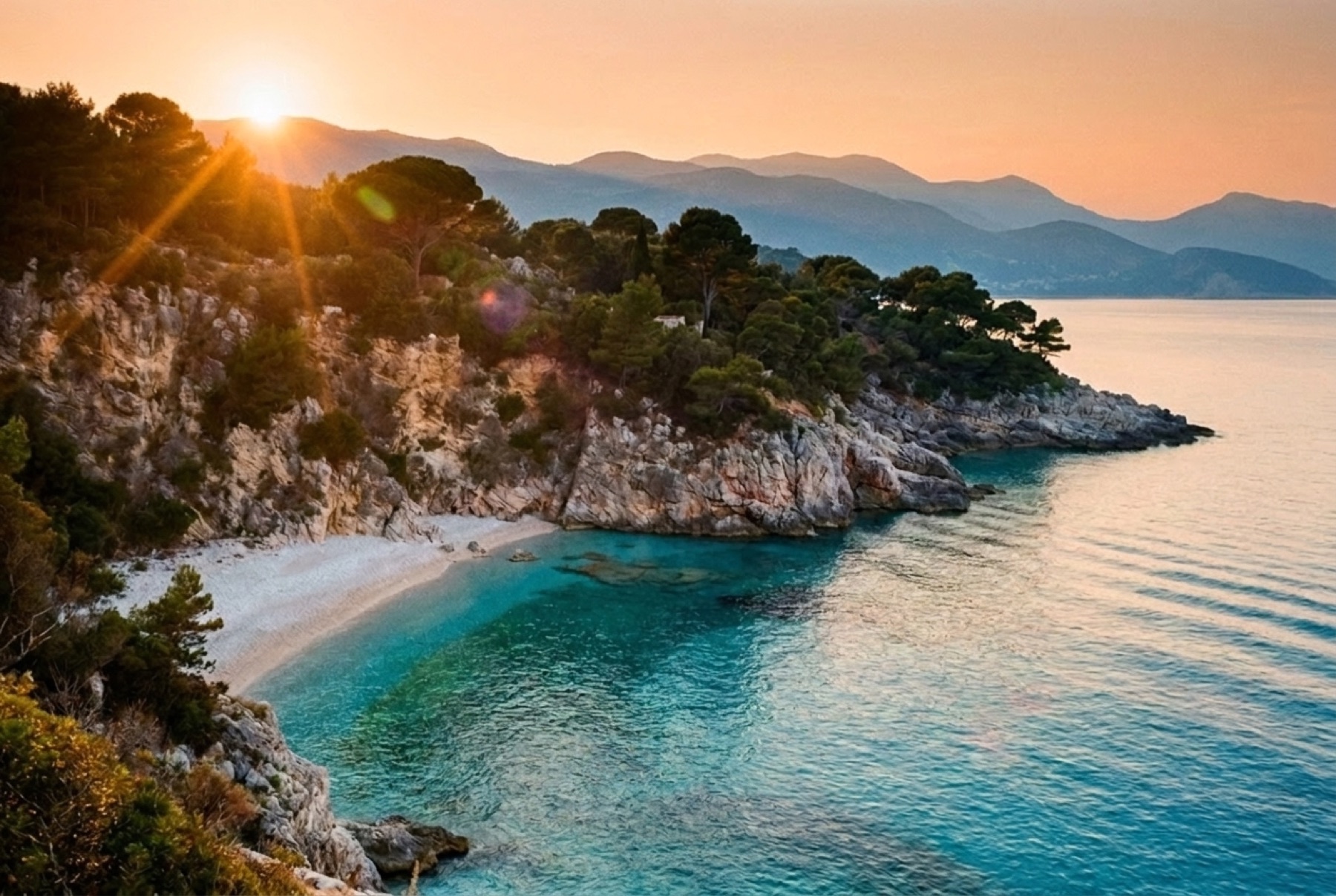 A hidden Riviera cove at golden hour, pines above a pale beach and turquoise water