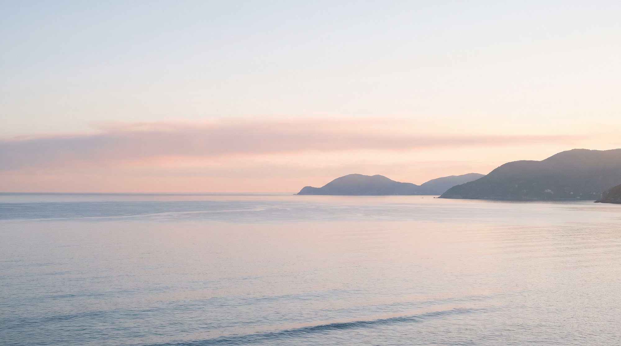 A mirror-flat dawn sea — the morning that never made anyone seasick